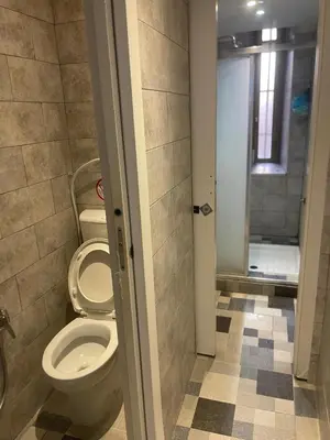 a bathroom with a toilet and a shower at Parenti B&B in Rome