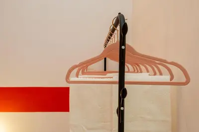a wooden hanger with a racket on a wall at ColoRHome in Rome