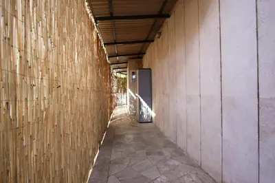 a hallway of a building with a wall at Ponte Milvio Lovely Garden in Rome