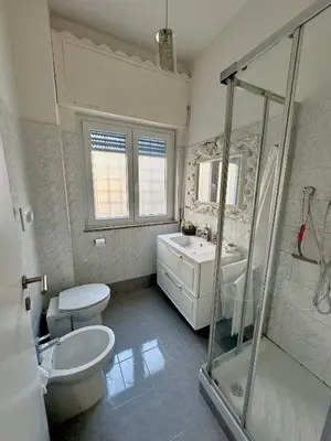 a bathroom with a toilet and a sink and a shower at La Casa di G Metro A tra Vaticano e Gemelli in Rome