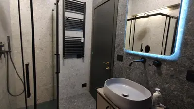 a bathroom with a sink and a mirror at Auri Vatican apartment in Rome