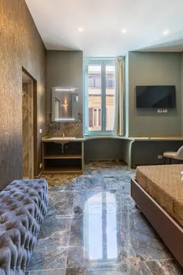 a hotel room with a bed and a mirror at Piazza di Spagna 51 Luxury guest house in Rome