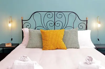 a bedroom with a bed with two towels on it at TM Apartment in Rome
