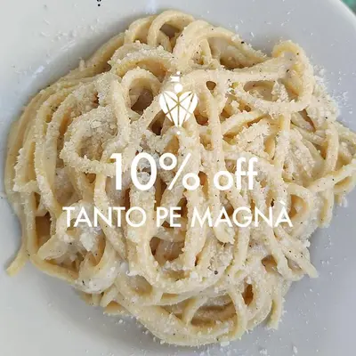 a pile of pasta on a white plate at Biffi 2 - Garbatella Rooms in Rome