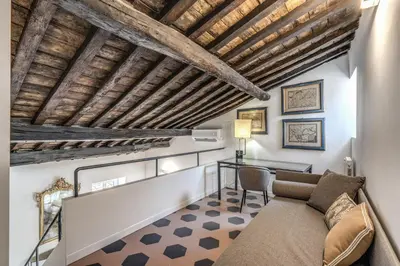 a living room with a couch and a table at Cisterna 8 in Rome