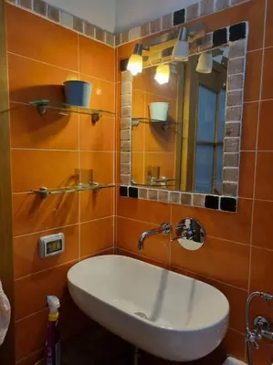 a bathroom with a sink and a mirror at Casa BiBi in Rome