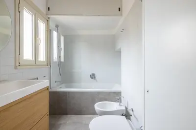 a bathroom with a tub and a toilet and a sink at Pantheon Apartment with Terrace in Rome