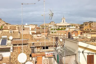 a view of the city from the roof of a building at Pantheon Apartment with Terrace in Rome