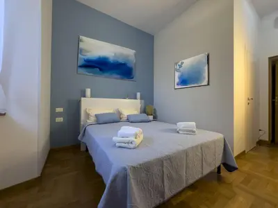 a bedroom with a bed with towels on it at I ricordi di San Pietro in Rome