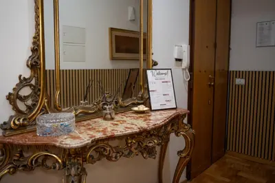 a mirror sitting on top of a table at I ricordi di San Pietro in Rome