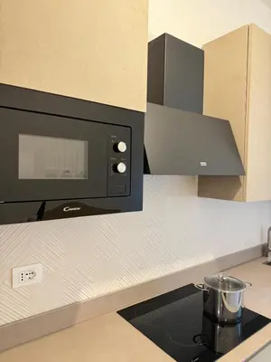 a microwave oven on a counter in a kitchen at Re di Roma Metro Hub - Rome Collection in Rome