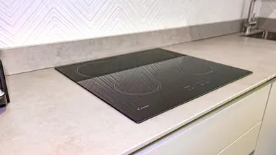 a kitchen counter top with a black stove top at Re di Roma Metro Hub - Rome Collection in Rome
