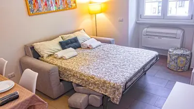 a small room with a bed and a couch at Re di Roma Metro Hub - Rome Collection in Rome