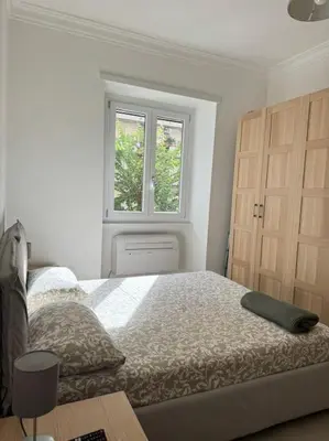 a bedroom with a bed and a window at Re di Roma Metro Hub - Rome Collection in Rome