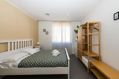 a bedroom with a bed and a book shelf at Sergio i Retreat in Rome