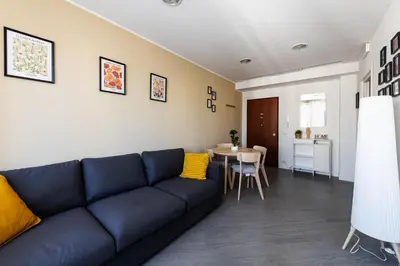 a living room with a blue couch and a table at Sergio i Retreat in Rome