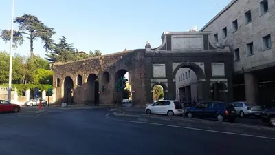 an old building with cars parked in front of it at NEXUS Palace in Rome