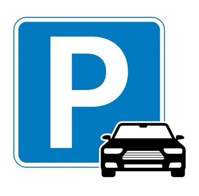 a sign with a car parked in front of a parking lot at NEXUS Palace in Rome
