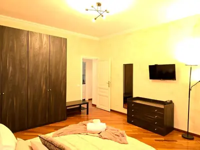 a bedroom with a bed and a tv and a dresser at Domus Prestige Vaticano 