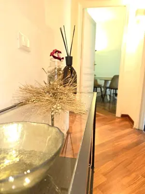 a glass bowl on a counter with a vase at Domus Prestige Vaticano 