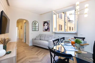 a living room with a table and a couch at La dolce vita Cavour in Rome
