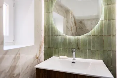 a bathroom with a sink and a mirror at La dolce vita Cavour in Rome