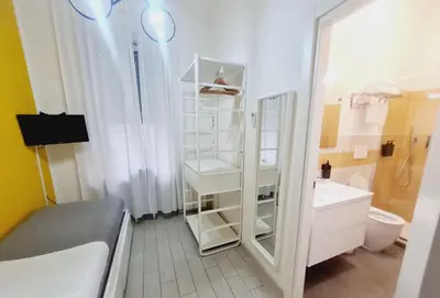 a bathroom with a shower and a toilet and a sink at Bed&BikeRome ANGELICO in Rome