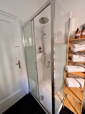 a shower with a glass enclosure in a bathroom at The Place Strozzi in Rome