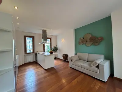 a living room with a couch and a table at Vincent's Place, Vatican City in Rome