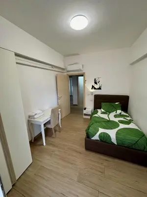 a bedroom with a bed and a desk in it at Grazioso appartamento Tiburtina - 3 bedrooms in Rome