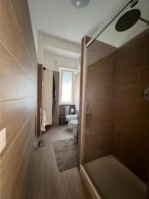 a bathroom with a shower and a toilet at Grazioso appartamento Tiburtina - 3 bedrooms in Rome