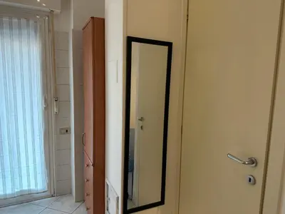 a mirror on a door in a room at ROMA Metro A in Rome