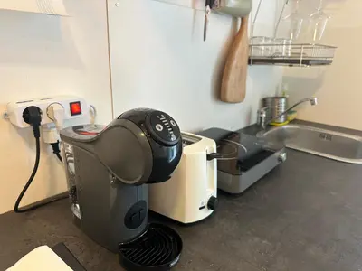 a kitchen counter with a mixer and a sink at ROMA Metro A in Rome