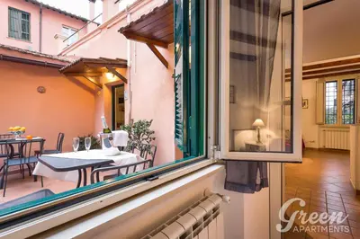 a view from a window of a balcony with a table at Green Apartments Rome in Rome