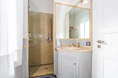 a bathroom with a sink and a shower at kathy Home Rome Suite in Rome