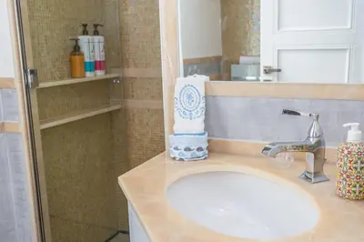 a bathroom counter with a sink and a mirror at kathy Home Rome Suite in Rome