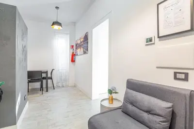 a living room with a couch and a table at kathy Home Rome Suite in Rome