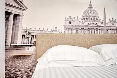 a bed with white sheets in front of a building at Caesar's quarters - private rooms in Rome in Rome