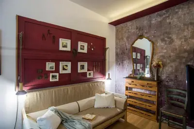a living room with a bed with a tv on it at Apartment in the center of Rome in Rome