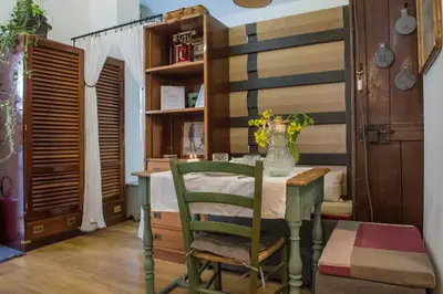 a table with two chairs and a table with a drink at Apartment in the center of Rome in Rome