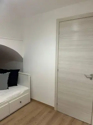 a bedroom with a bed and a sliding door at Caroline Home in Rome