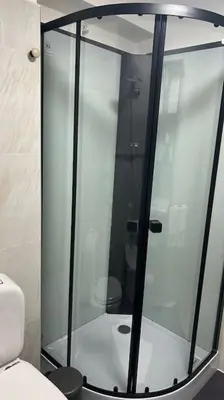 a glass shower in a bathroom with a toilet at Caroline Home in Rome