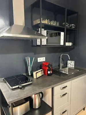 a kitchen with a counter top with a sink at Caroline Home in Rome