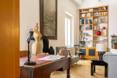 a living room with a desk and a book shelf at Angi's home the new Luxury in Rome heart in Rome