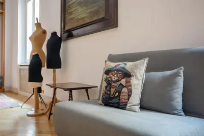 a living room with a couch with a pillow on it at Angi's home the new Luxury in Rome heart in Rome