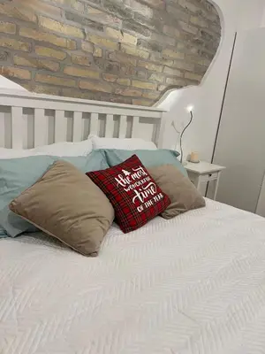 a bed with two pillows on top of it at Malila's-Cipitelli Trevi in Rome