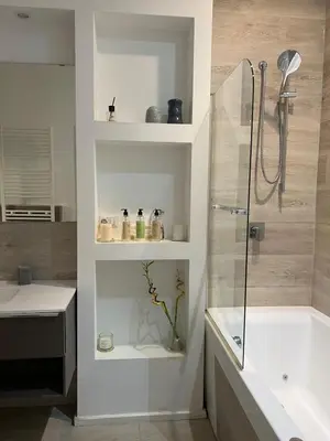 a bathroom with a shower and a sink and a tub at Malila's-Cipitelli Trevi in Rome