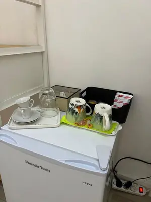 a table with a tea set on top of a washing machine at Malila's-Cipitelli San Pietro in Rome