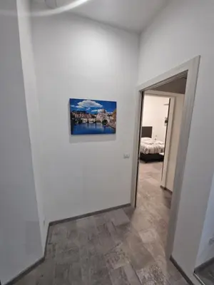 a white room with a painting on the wall at Relux Pretoria Rooms in Rome