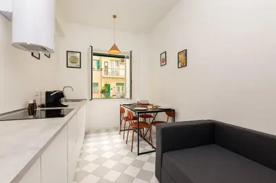 a kitchen with a counter and a table in a room at NiMa Holiday 49 in Rome